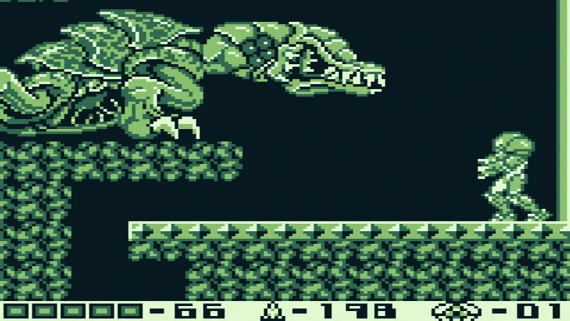Ảnh chụp màn hình gameplay của Metroid II: Return of Samus trên Game Boy, với Samus Aran đối đầu Metroid trên SR388 trong giao diện đơn sắc.