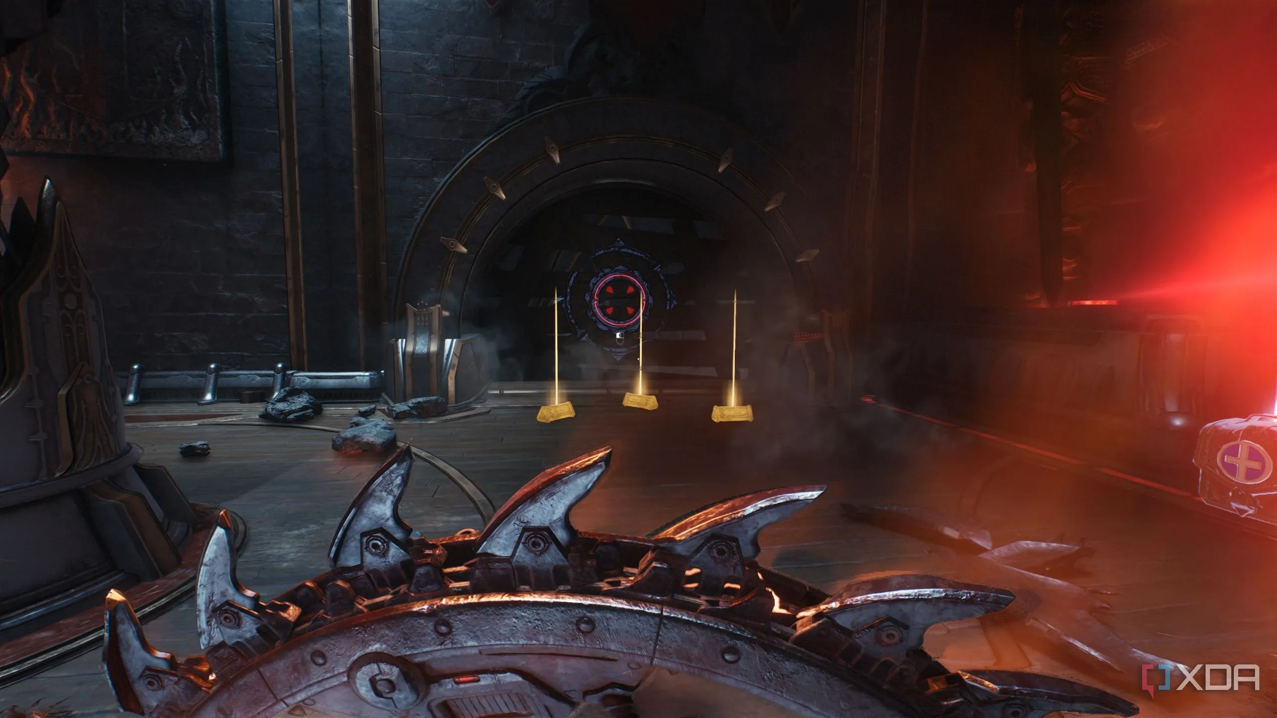 Ba thỏi vàng lấp lánh trên nền đất cạnh bức tường gỗ có thể phá vỡ bằng Shield Charge trong Doom: The Dark Ages