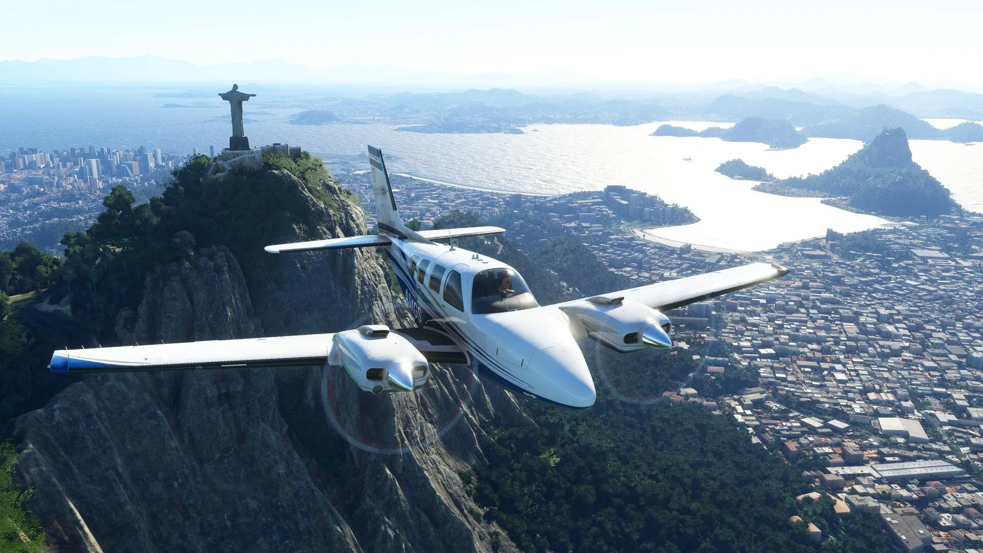 Cảnh chơi game Microsoft Flight Simulator trên màn hình siêu rộng, cho thấy khả năng đắm chìm tuyệt đối và góc nhìn bao quát khung cảnh thành phố Rio sống động.