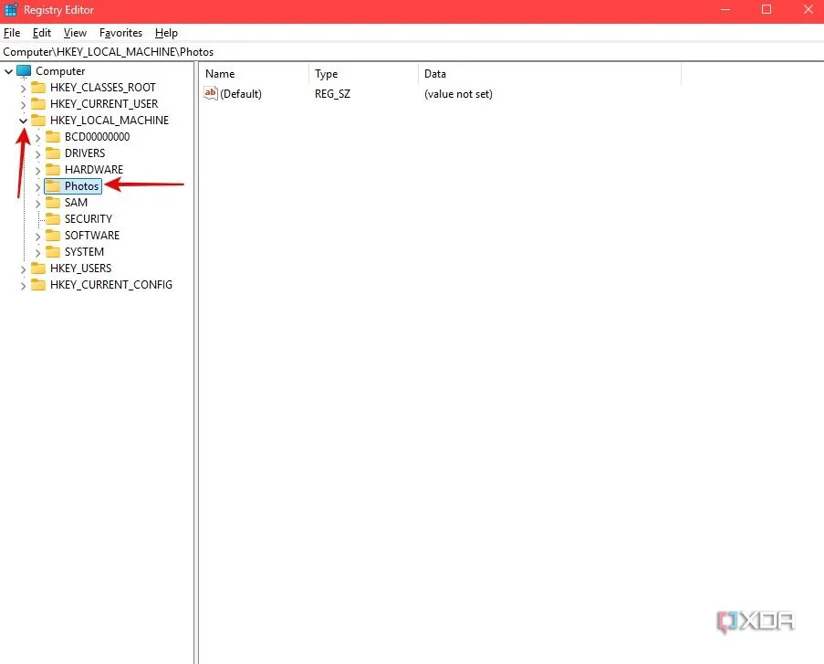 Chọn thư mục 'Photos' trong cây HKEY_LOCAL_MACHINE trong Registry Editor sau khi tải tệp cài đặt