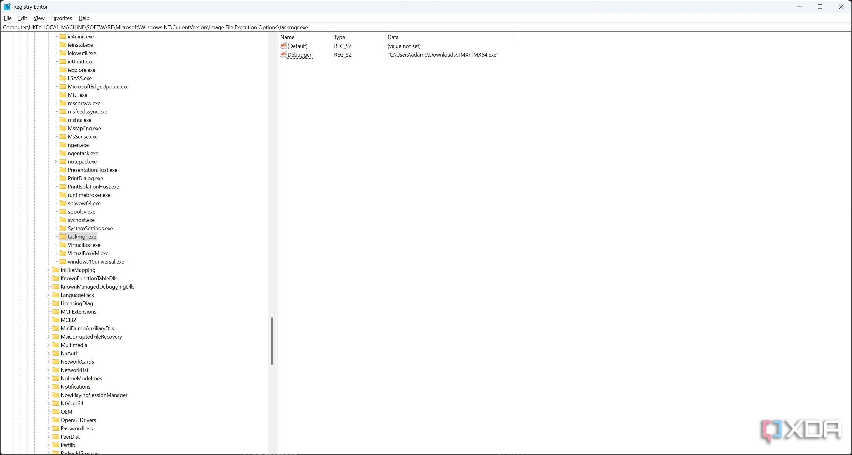 Cửa sổ Registry Editor chỉnh sửa giá trị Debugger để thay thế Task Manager trên Windows.