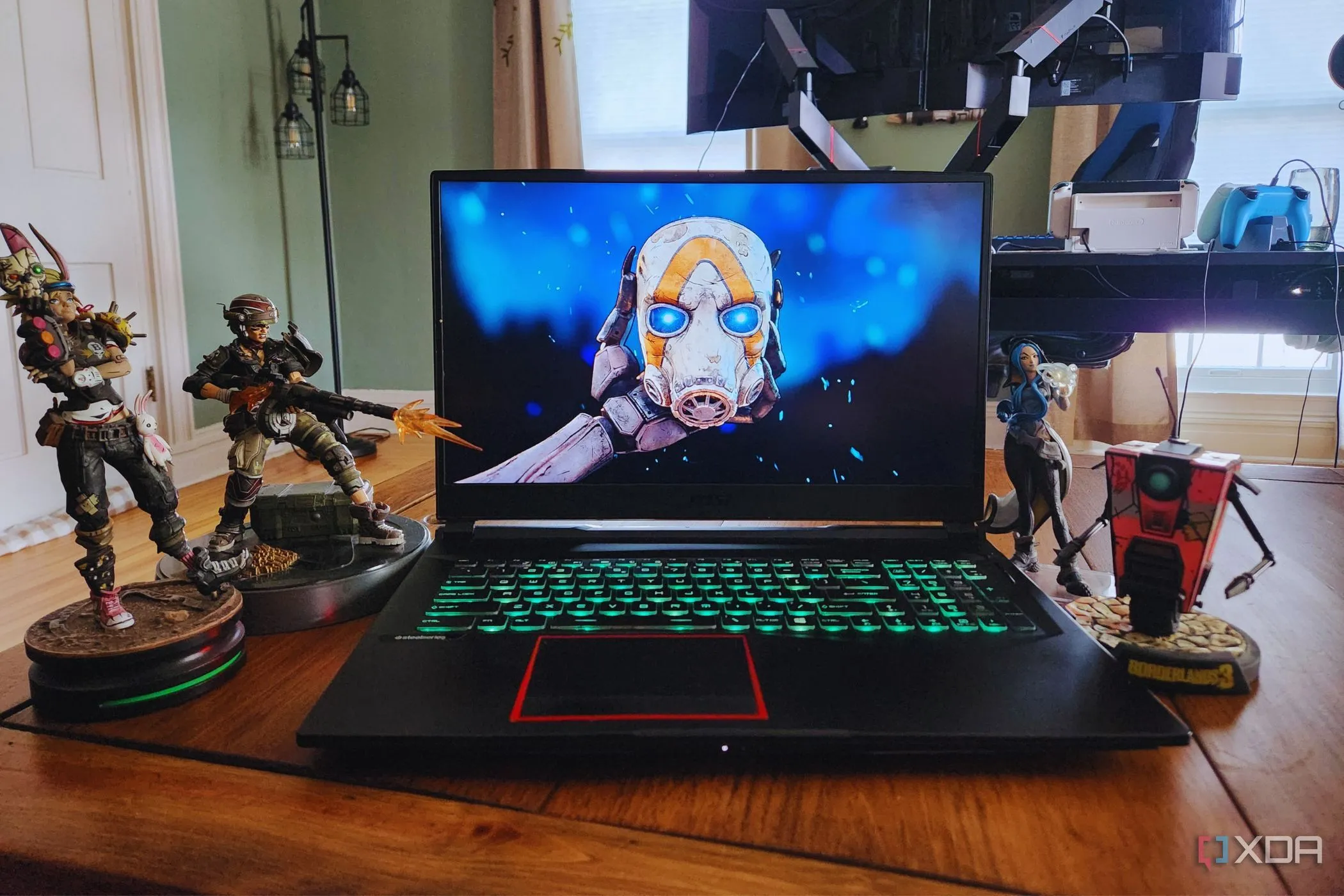 Laptop với các nhân vật hành động và logo Borderlands 4, thể hiện sự háo hức chờ đợi game mới