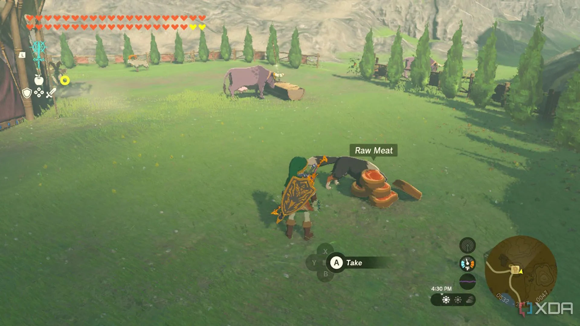 Link đang cho chó ăn tại một chuồng ngựa ở Hyrule trong The Legend of Zelda: Tears of the Kingdom