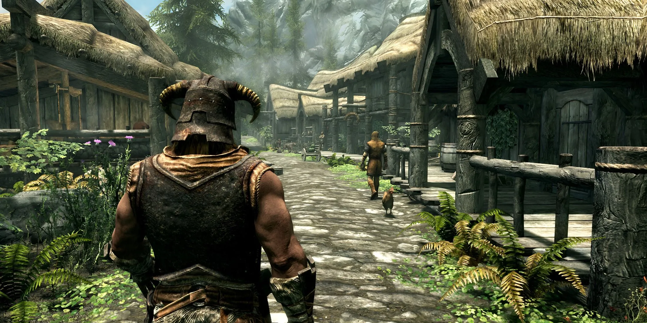 Nhân vật Dragonborn trong game The Elder Scrolls V: Skyrim đang đi dạo trong một ngôi làng.
