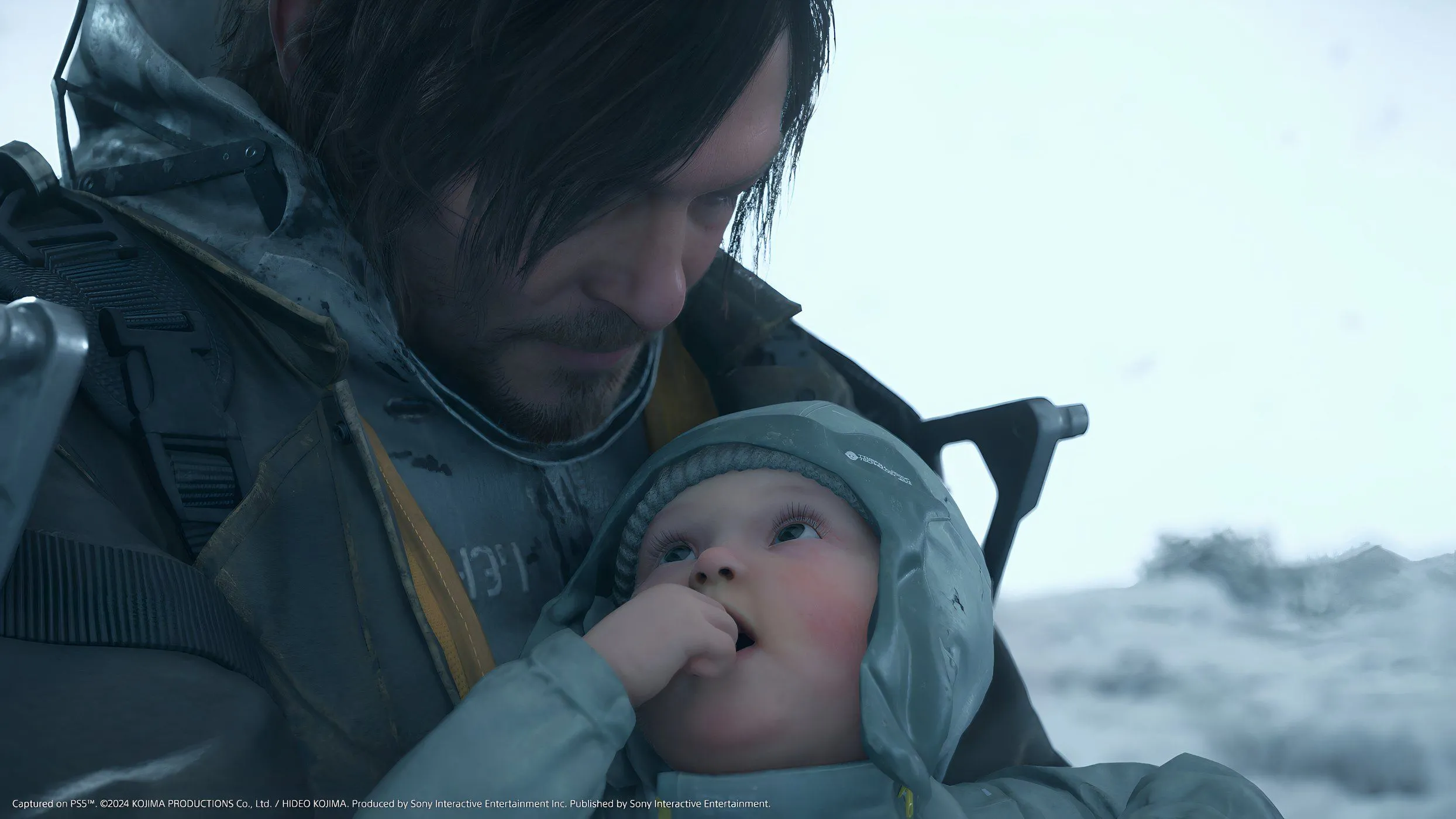 Sam Porter Bridges cùng em bé BB trong khung cảnh hậu tận thế của Death Stranding 2: On the Beach